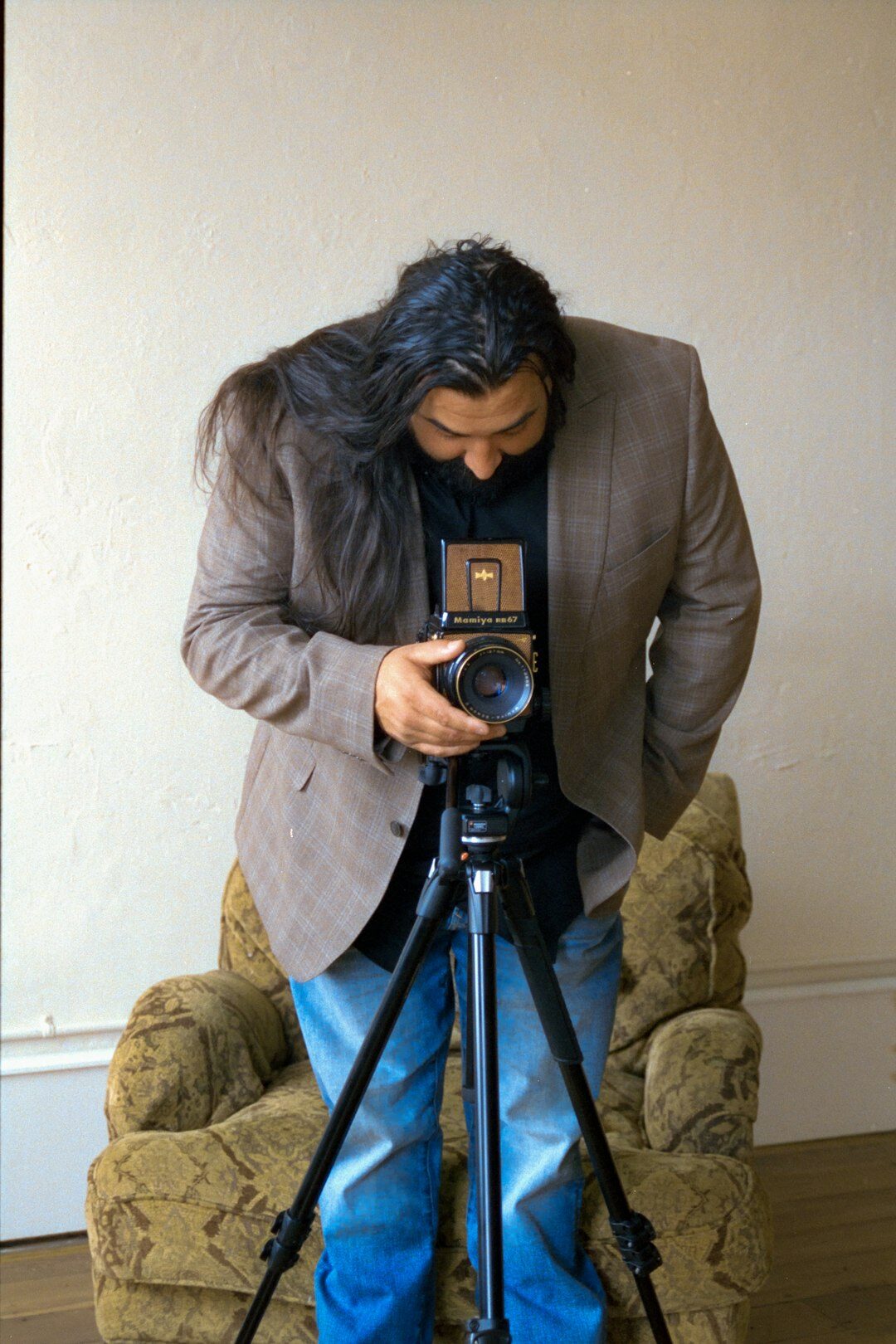 Camera operator filming an interview session in a professional studio